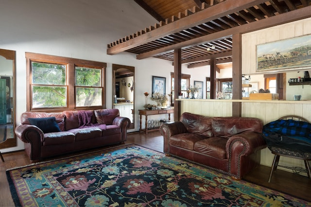 living room featuring lofted ceiling with beams and dark hardwood / wood-style floors