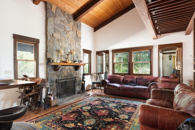 living room with wood ceiling, a stone fireplace, hardwood / wood-style floors, and high vaulted ceiling