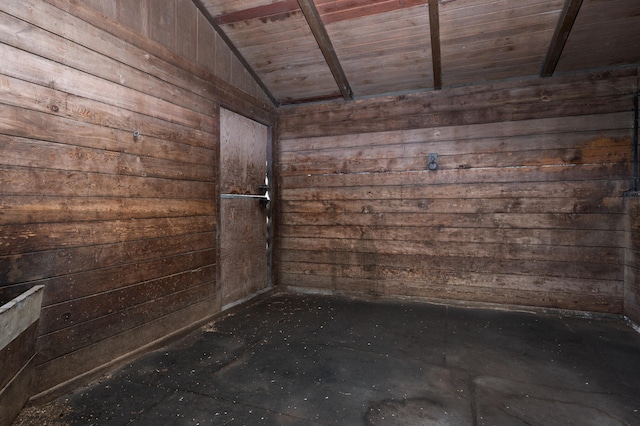 spare room featuring wood ceiling and lofted ceiling