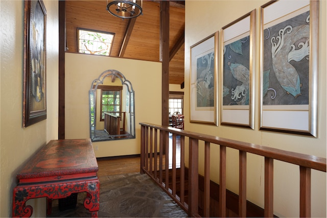 hall with wood ceiling, lofted ceiling, and dark hardwood / wood-style floors