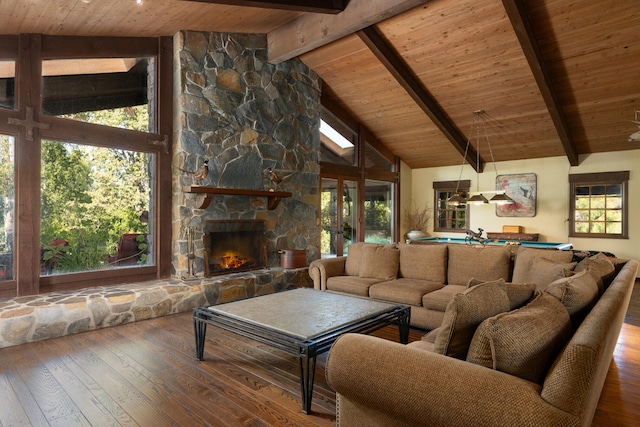 unfurnished living room featuring beam ceiling, dark hardwood / wood-style flooring, a stone fireplace, high vaulted ceiling, and wood ceiling