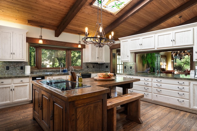 kitchen featuring white cabinets, wood ceiling, a chandelier, and tasteful backsplash