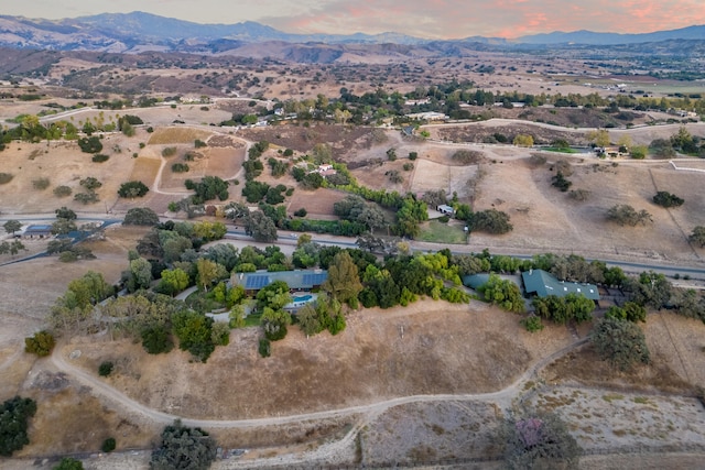 aerial view at dusk with a mountain view