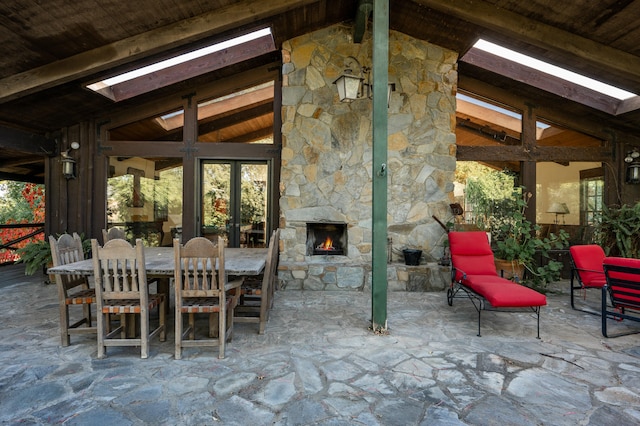 view of patio with an outdoor stone fireplace