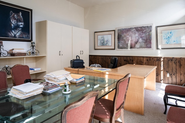 home office featuring built in desk and carpet flooring