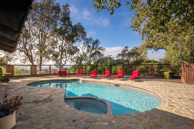 view of swimming pool featuring a patio area