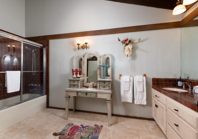 bathroom featuring shower / bath combination with glass door, vanity, and tile flooring