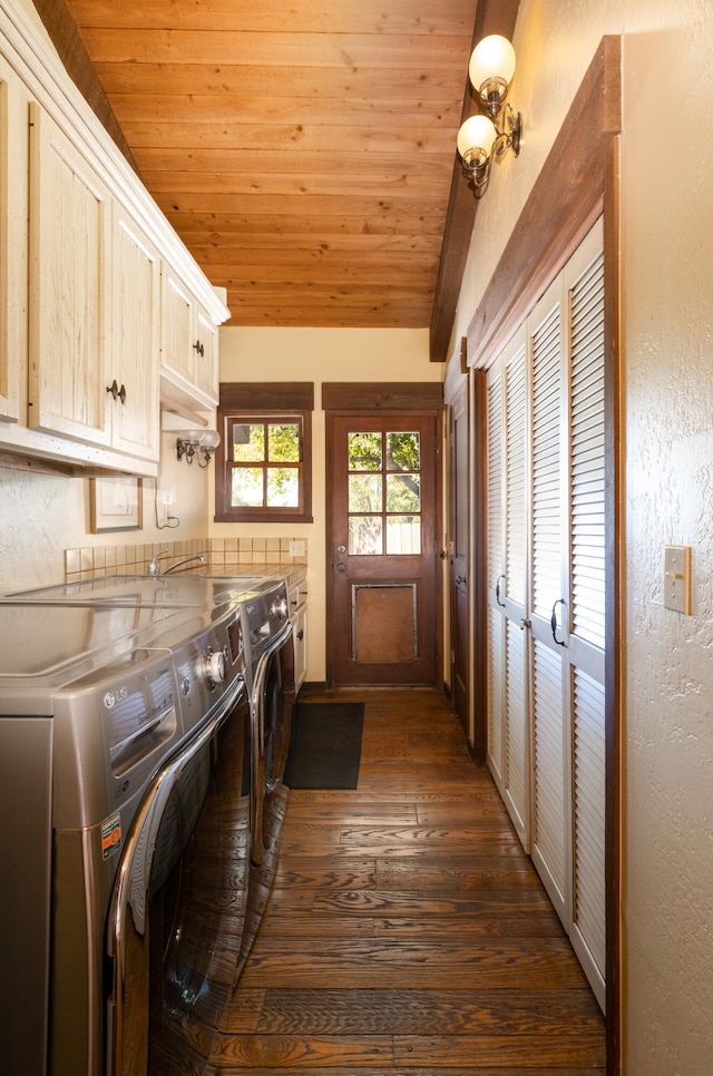 clothes washing area with cabinets, dark hardwood / wood-style floors, wood ceiling, and separate washer and dryer