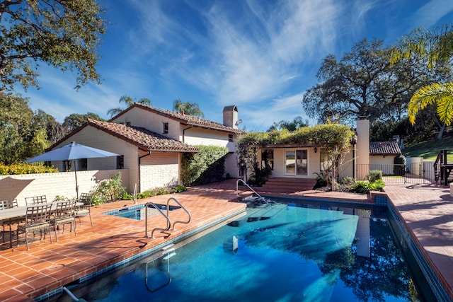 view of swimming pool featuring a patio