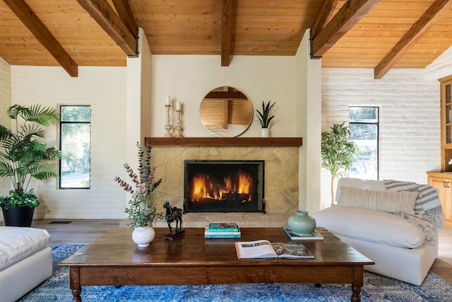 living room with beam ceiling, dark hardwood / wood-style floors, and wood ceiling