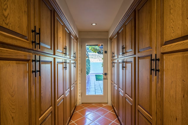 doorway to outside featuring light tile floors