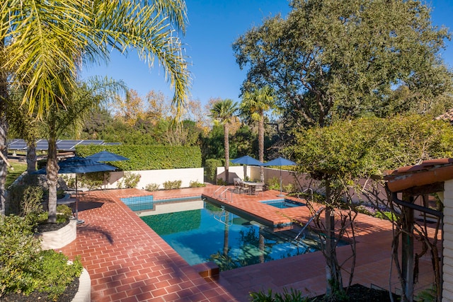 view of swimming pool with a patio