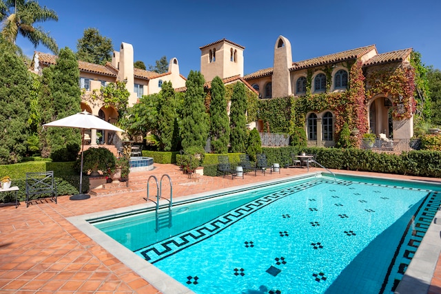 view of swimming pool with a patio area