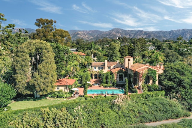 birds eye view of property with a mountain view