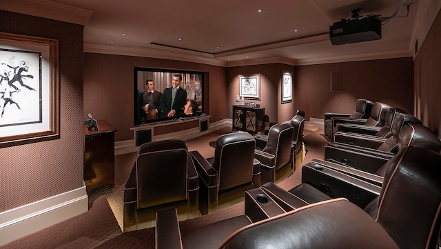 home theater featuring carpet flooring and ornamental molding