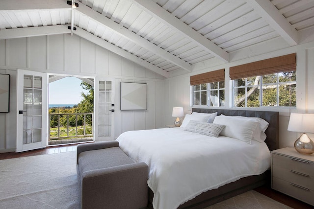 bedroom with access to exterior, vaulted ceiling with beams, hardwood / wood-style flooring, and multiple windows