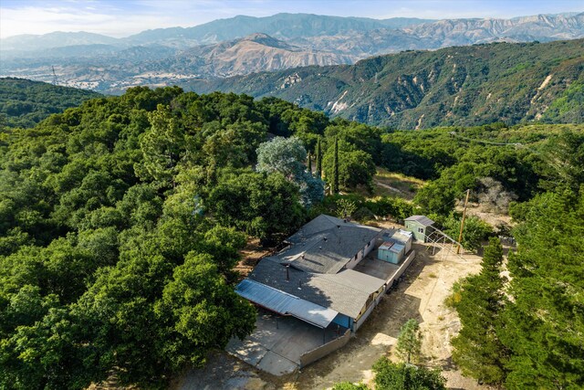 birds eye view of property featuring a mountain view