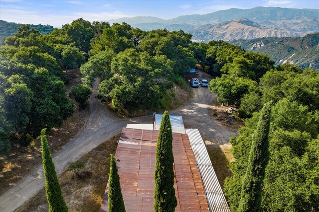 birds eye view of property featuring a mountain view