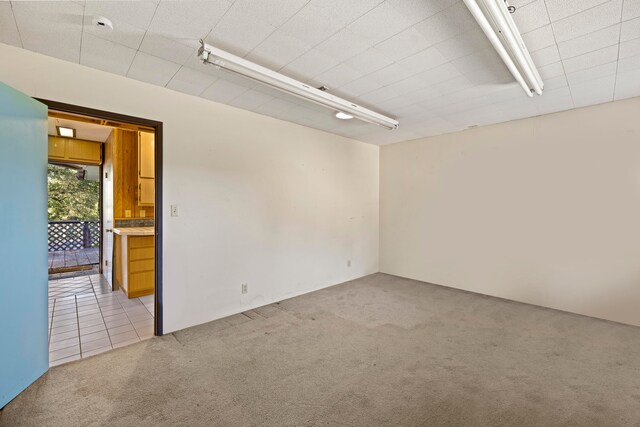 empty room featuring light colored carpet