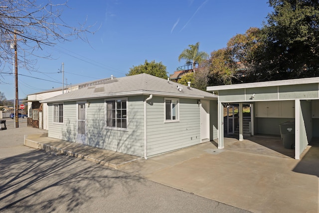 rear view of house with a carport