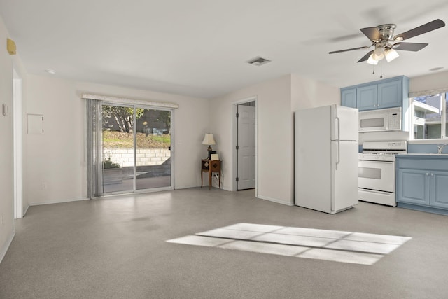 kitchen featuring a healthy amount of sunlight, blue cabinets, ceiling fan, and white appliances