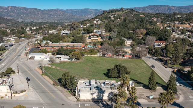 birds eye view of property featuring a mountain view