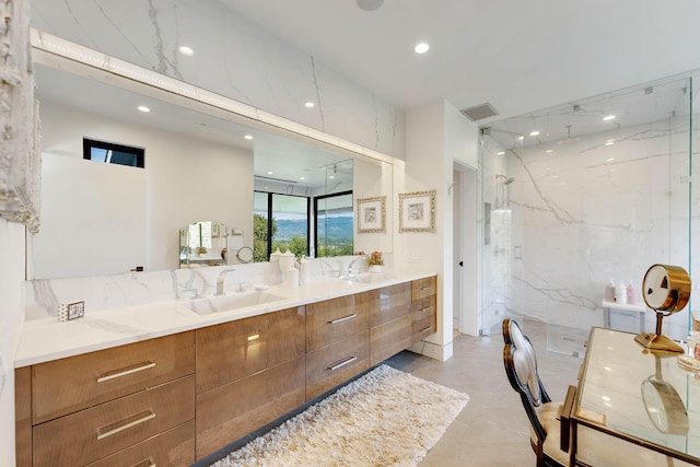 bathroom featuring vanity, tile walls, and an enclosed shower