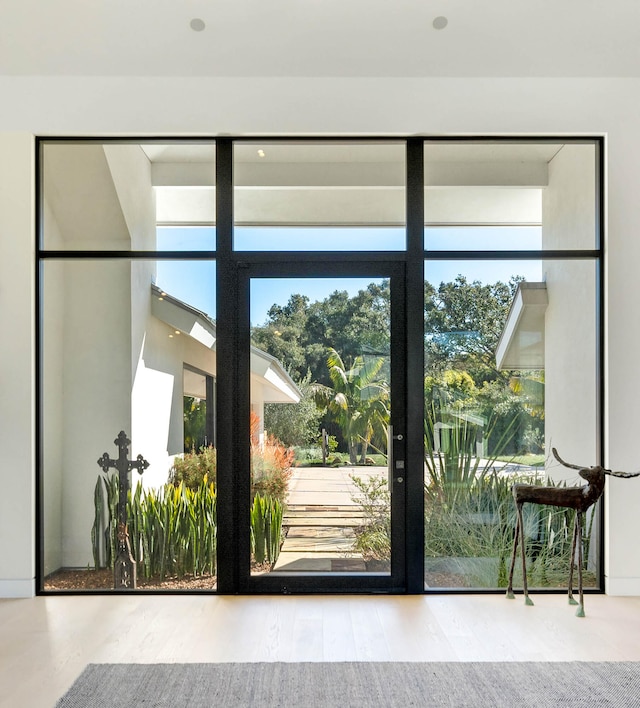 doorway to outside with hardwood / wood-style floors