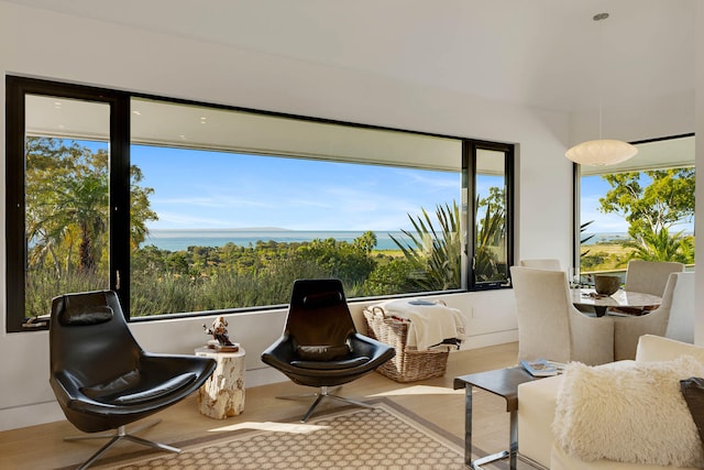 sitting room featuring a water view