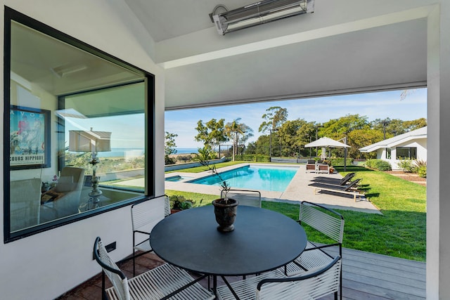 view of swimming pool with a lawn and a patio area