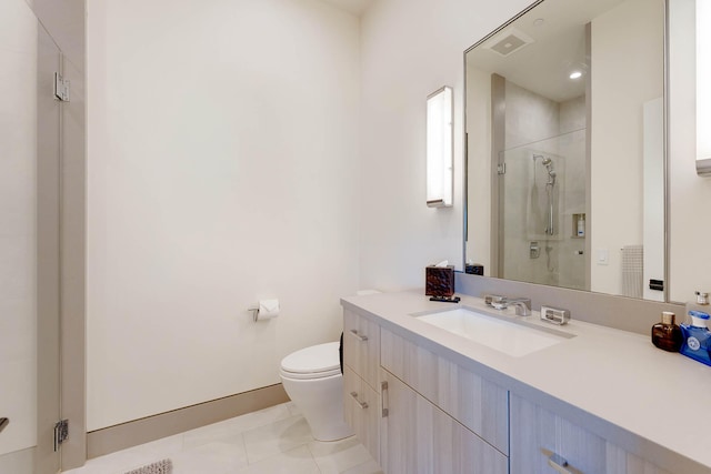 bathroom featuring an enclosed shower, vanity, tile patterned flooring, and toilet