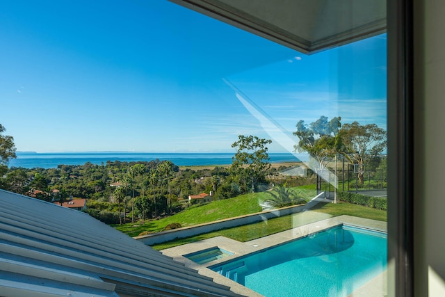 view of swimming pool with a water view