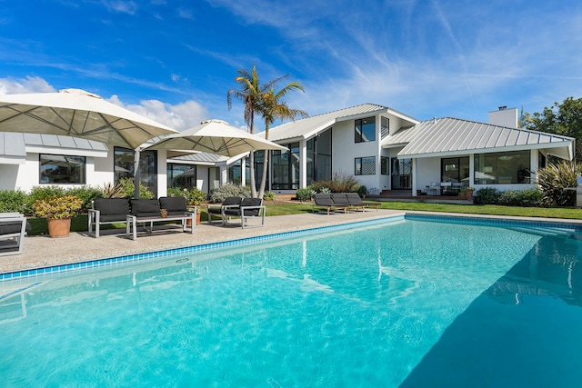 view of pool featuring a patio area