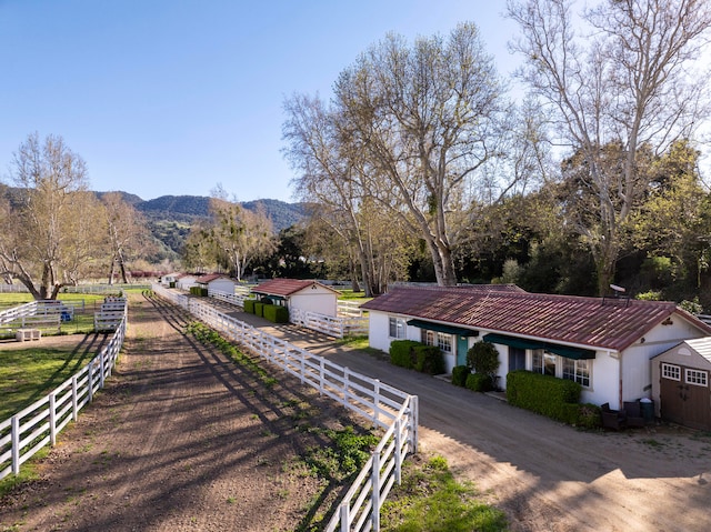 exterior space featuring a mountain view and a rural view