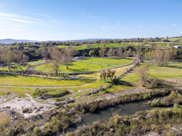 birds eye view of property with a rural view