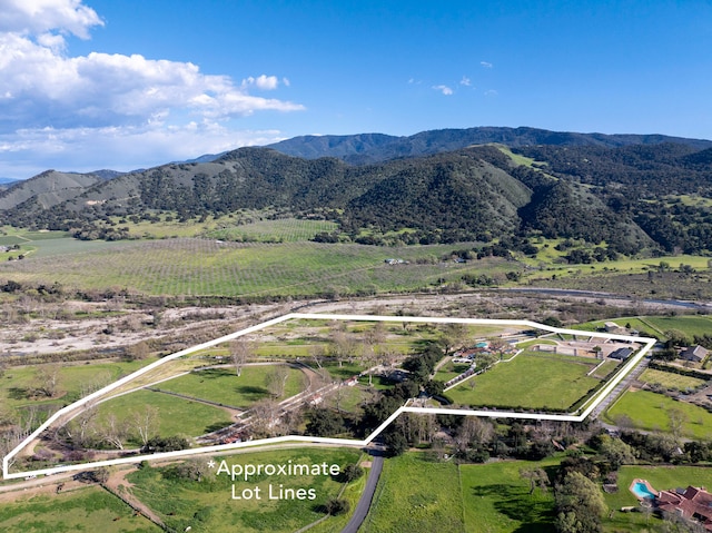 drone / aerial view with a rural view and a mountain view