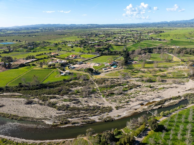 drone / aerial view with a rural view and a water view