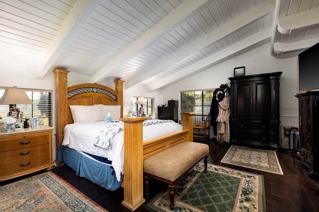 bedroom with ornate columns, vaulted ceiling with beams, and dark hardwood / wood-style flooring