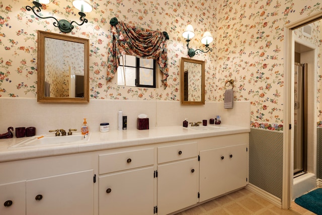 bathroom featuring dual vanity, tile floors, a shower with shower door, and backsplash