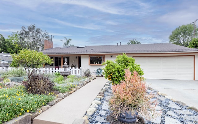 ranch-style home featuring a garage