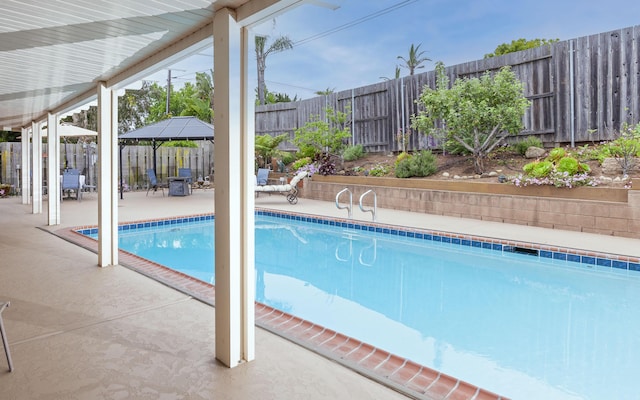 view of pool featuring a gazebo and a patio area