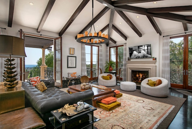 living room with beamed ceiling, hardwood / wood-style floors, french doors, and high vaulted ceiling