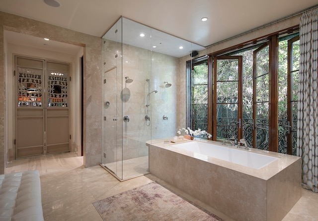 bathroom with tile floors and plus walk in shower