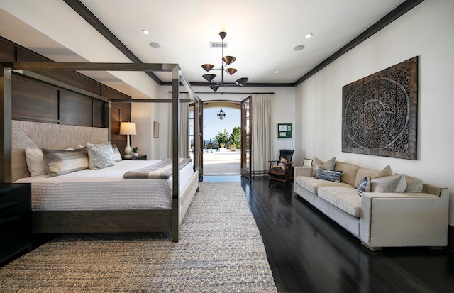 bedroom featuring a notable chandelier, dark wood-type flooring, and access to exterior