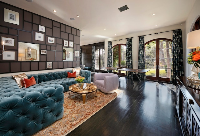 living room with wood-type flooring and french doors