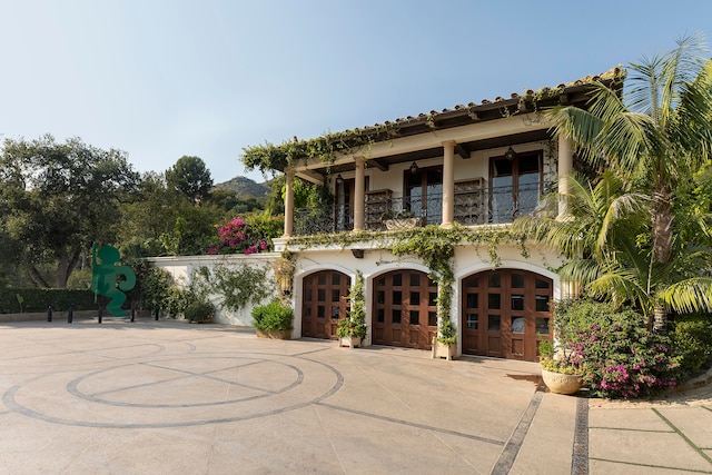 mediterranean / spanish home featuring a balcony