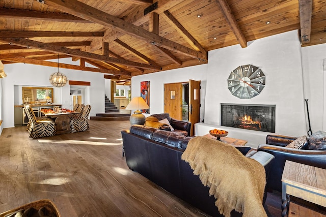 living room with beam ceiling, wood ceiling, wood-type flooring, an inviting chandelier, and high vaulted ceiling