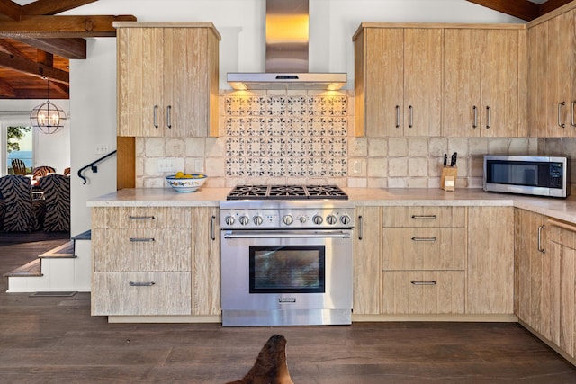 kitchen featuring appliances with stainless steel finishes, dark hardwood / wood-style floors, tasteful backsplash, and wall chimney exhaust hood