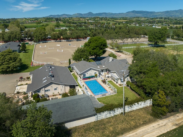 birds eye view of property featuring a mountain view