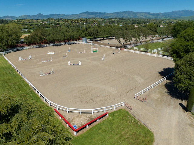 birds eye view of property with a mountain view and a rural view